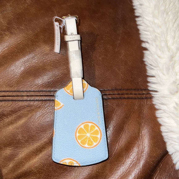 Coach Handbags - NEW PERFECT CONDITION Lemon Coach Luggage Tag
